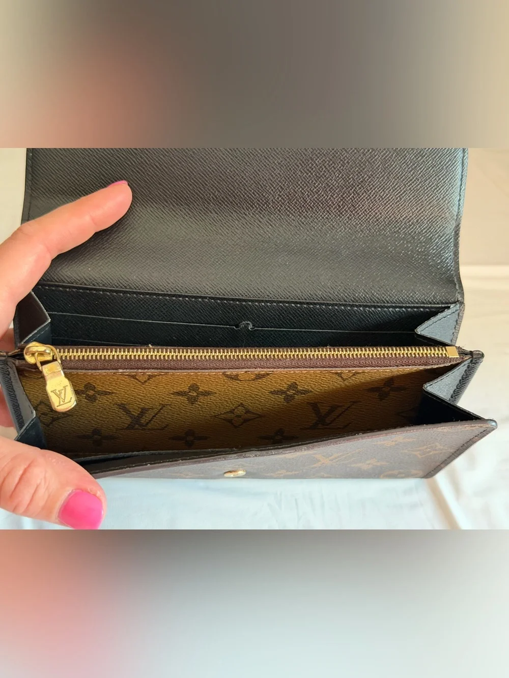 Louis Vuitton Sarah wallet in reverse monogram